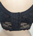 Black Elomi Charley longline lace bra on a mannequin against a white background. Style EL4381. Back view.