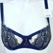 An Aubade fashion bra, Reve a Louxor, a demi bra in black with gold mesh and trim. Color Black. Style Y414.
