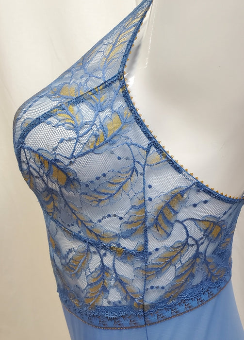 A beauty of a bodysuit from Lou, Wonderful. From France, made with lace and a leaf motif. Color Bleu. Style 67252.