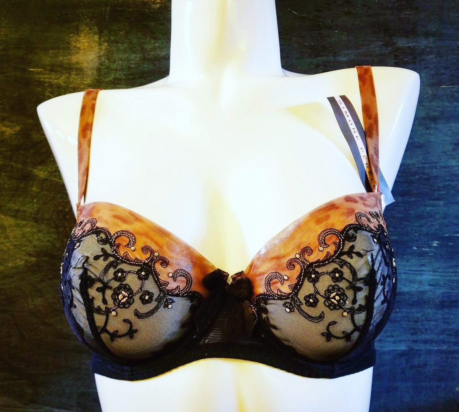 Merveille by Simone Perele. A demi bra, wired, with sheer cups that is both refined and modern. The deep cups give shape and control. Style 197330.